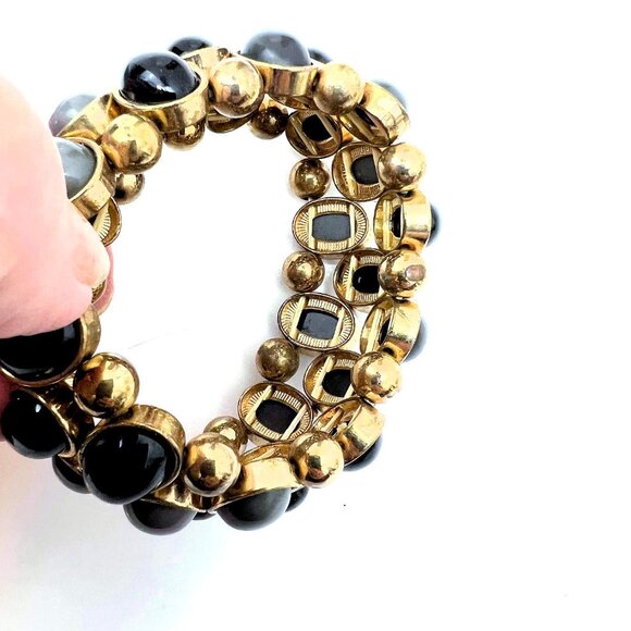 Gold tone stretch bracelet with gray and black cabochons accent. - Picture 3 of 5